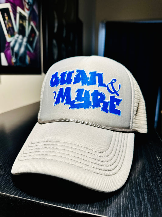 QUAN & MYRE GREY CAP WITH BLUE LOGO DESIGN