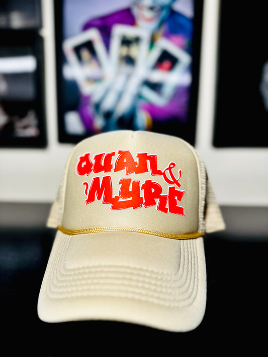 QUAN & MYRE TAN CAP WITH RED LOGO DESIGN