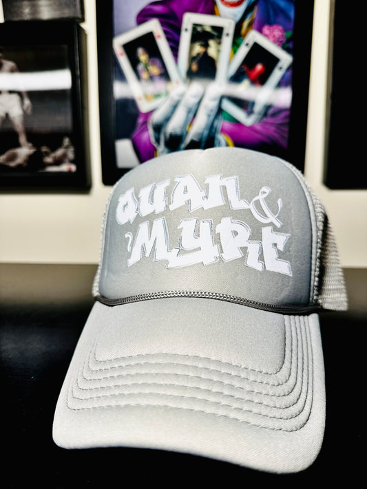 QUAN & MYRE GREY CAP WITH WHITE LOGO DESIGN